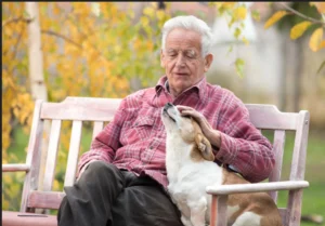 Senior man with service dog covered by Medicaid